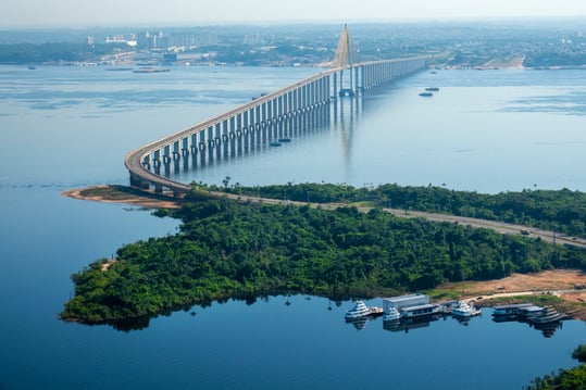 Manaus, Brazil - Journalist Phelippe Daou Bridge over Negro River. Manaus (background) is capital of the State of Amazonas. GettyImages-1094216738