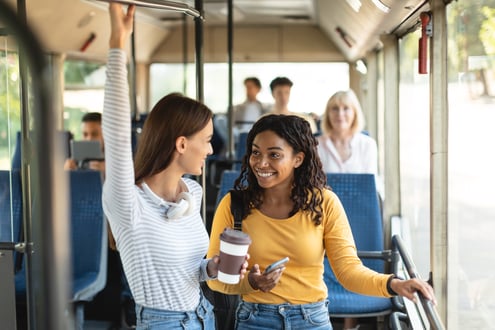 beautiful-smiling-ladies-standing-in-bus-and-talki-2021-12-09-07-53-29-utc (1)